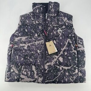 Nike ACG Puffy Vest in Black and Light Pink Splatter Print
